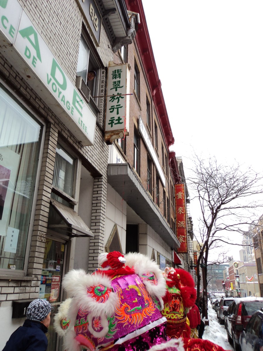 Lettuce and red envelope dangle from second story